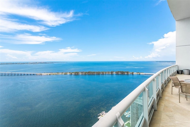 balcony featuring a water view