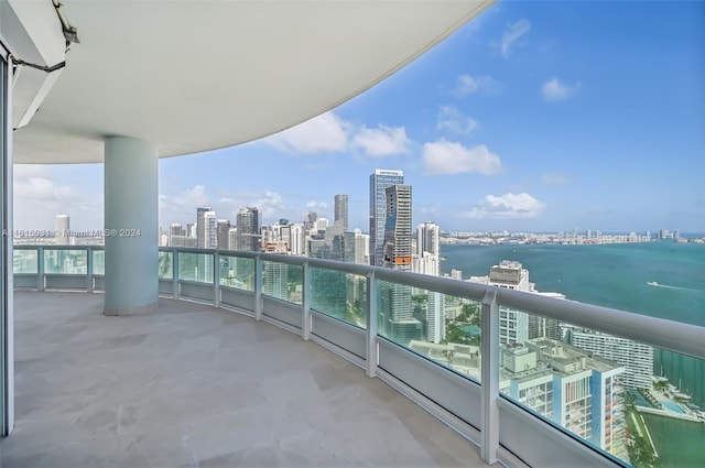 balcony featuring a water view