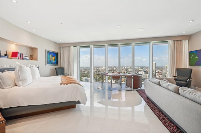 bedroom with access to exterior, expansive windows, and light tile patterned flooring