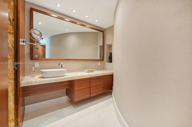 bathroom featuring tile patterned flooring and vanity