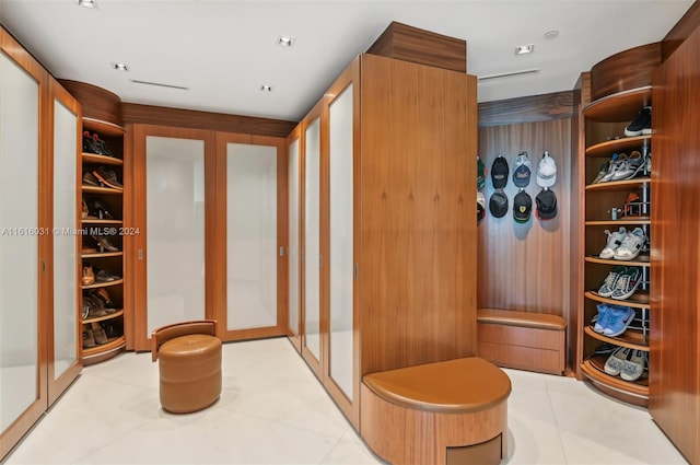 mudroom with light tile patterned floors