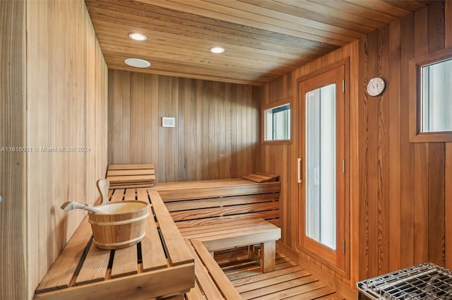 view of sauna / steam room with hardwood / wood-style floors, wooden walls, and wood ceiling