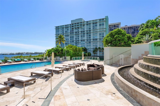 view of swimming pool with a patio area