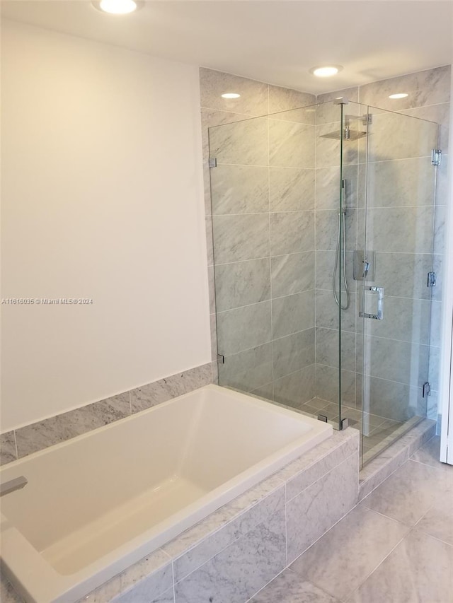 bathroom with tile patterned flooring and plus walk in shower