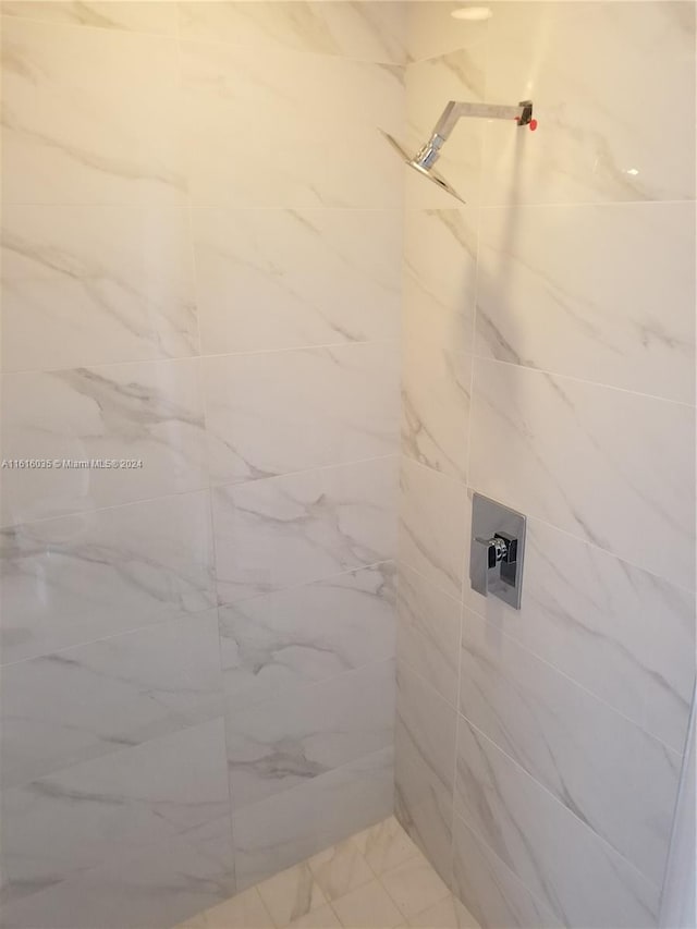 bathroom with tiled shower