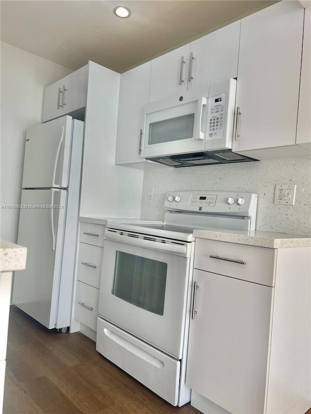 kitchen with white cabinets, decorative backsplash, white appliances, and dark wood-type flooring