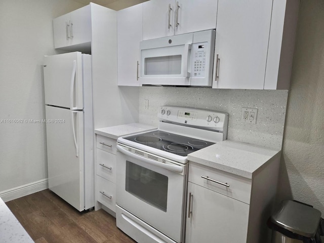 kitchen featuring white cabinetry, light stone countertops, tasteful backsplash, dark hardwood / wood-style flooring, and white appliances