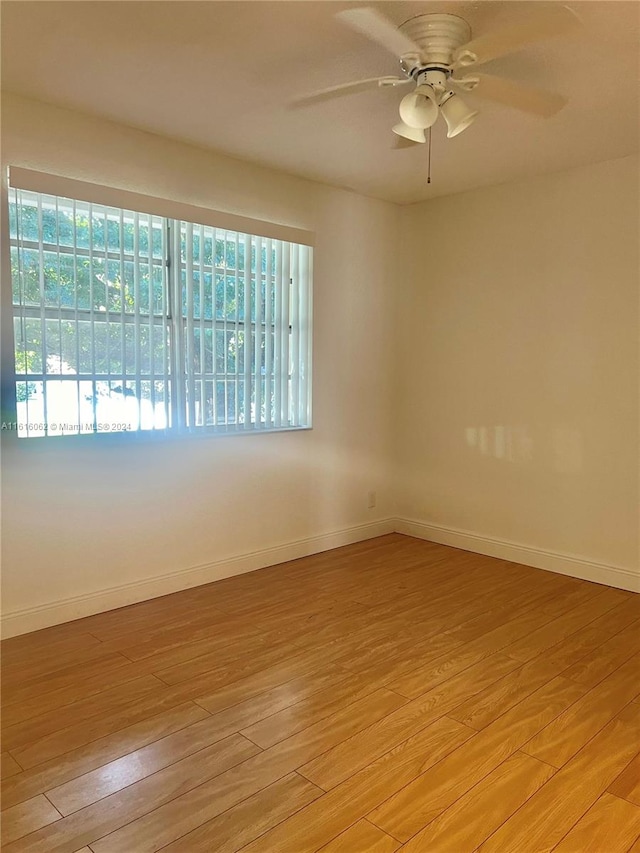 unfurnished room featuring ceiling fan and light wood-type flooring