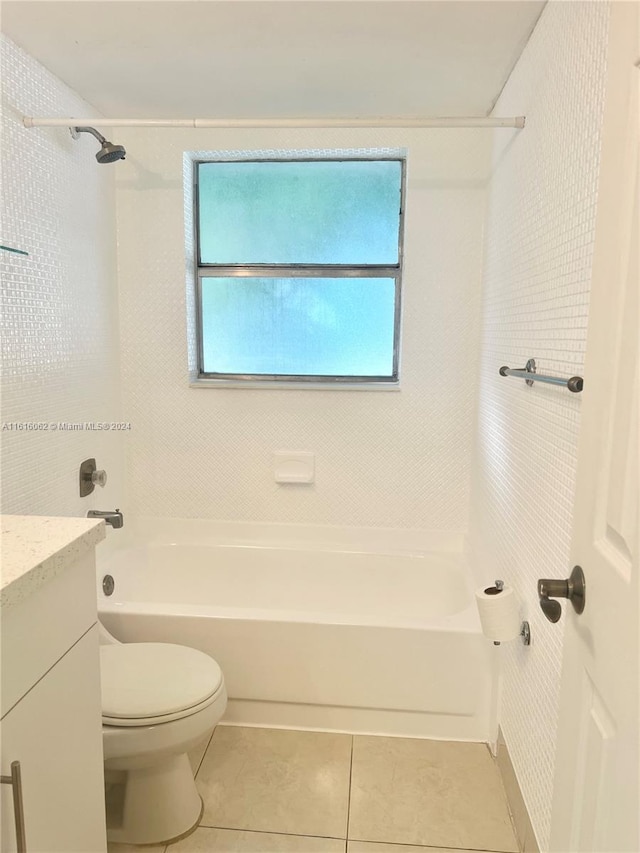 full bathroom with shower / washtub combination, tile patterned flooring, vanity, and toilet