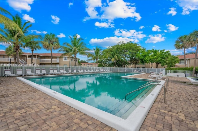 view of swimming pool with a patio area