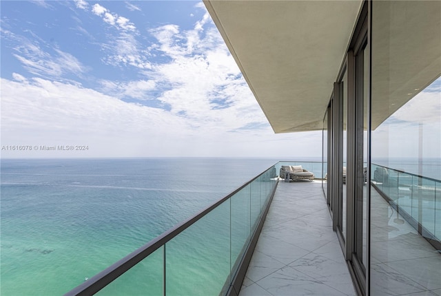 balcony featuring a water view