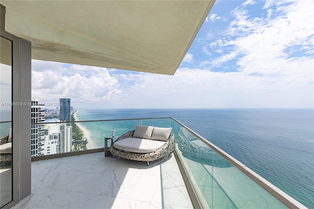 balcony featuring a water view