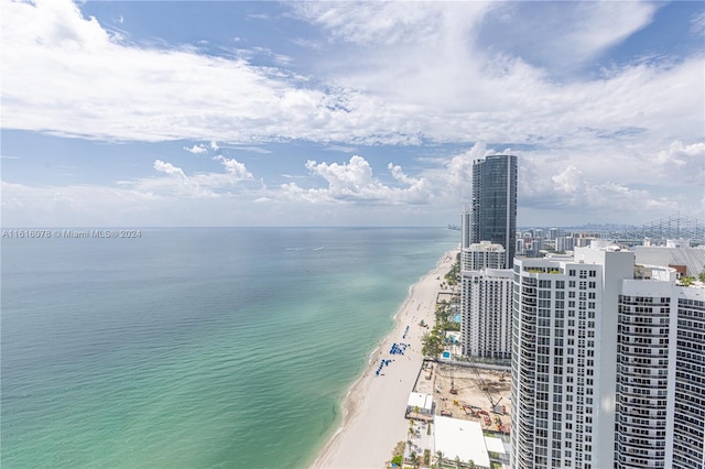 exterior space with a water view and a view of the beach