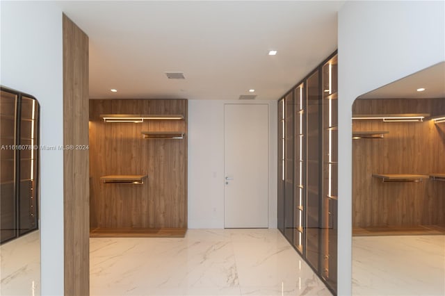 hall with light tile patterned flooring