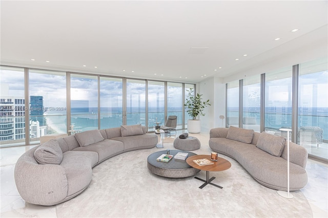 living room with a healthy amount of sunlight and a water view