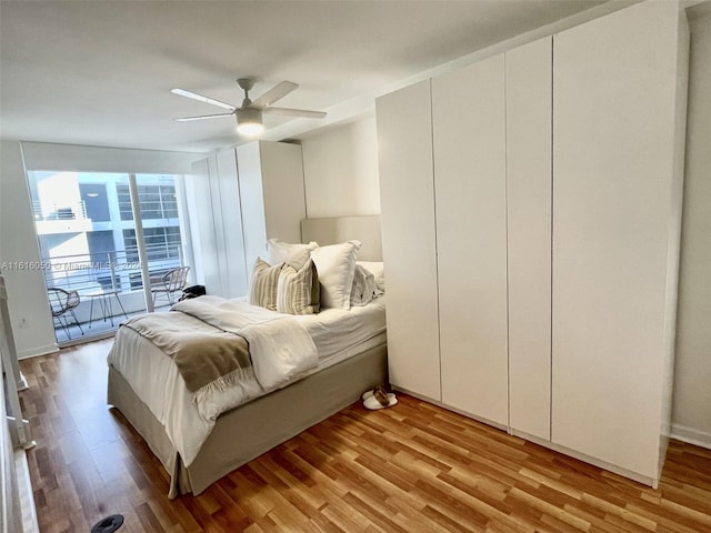 bedroom with access to outside, ceiling fan, a closet, and light hardwood / wood-style floors