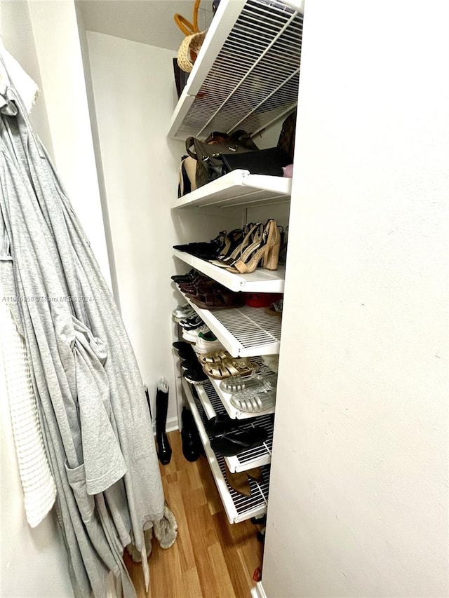 walk in closet featuring hardwood / wood-style floors