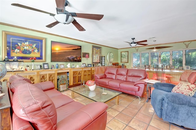 living room with ornamental molding, light tile patterned floors, and ceiling fan