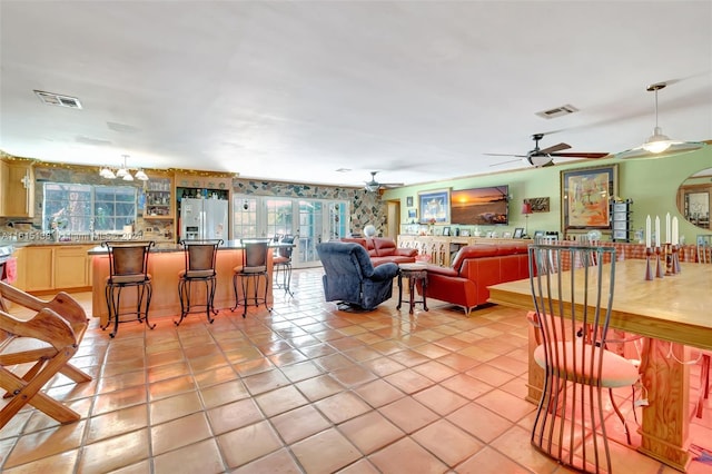 living room featuring light tile patterned floors and plenty of natural light