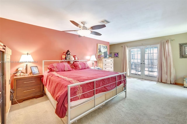 bedroom with french doors, access to exterior, light colored carpet, and ceiling fan