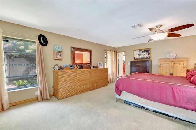 bedroom with ceiling fan and carpet flooring