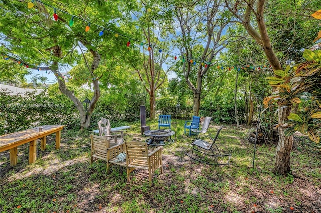 view of yard featuring a fire pit