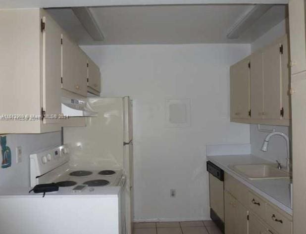 kitchen featuring range, light tile patterned floors, wall chimney range hood, dishwasher, and sink