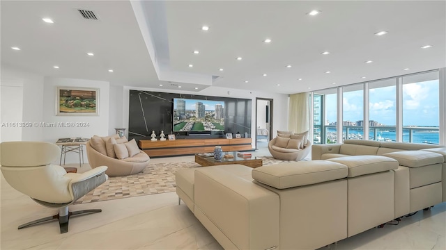 living room featuring floor to ceiling windows