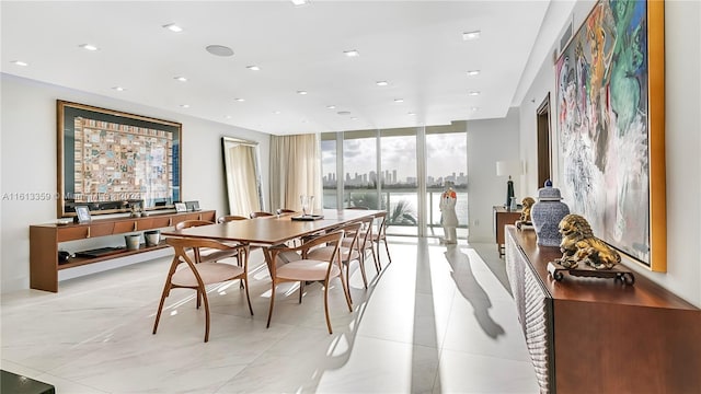 dining area featuring floor to ceiling windows