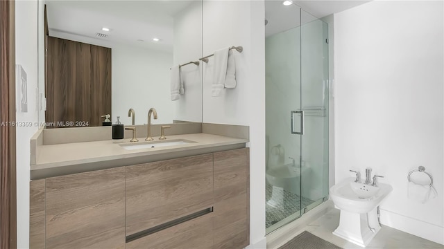 bathroom with a bidet, vanity, and a shower with shower door