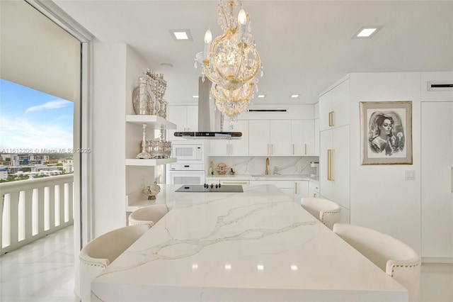 bedroom with visible vents, a chandelier, a sink, and recessed lighting