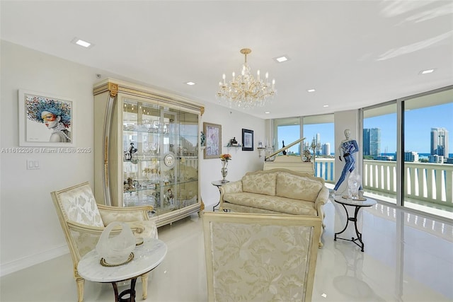 living area featuring a city view, recessed lighting, baseboards, expansive windows, and an inviting chandelier