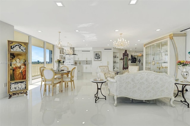 living area with a chandelier, expansive windows, and recessed lighting