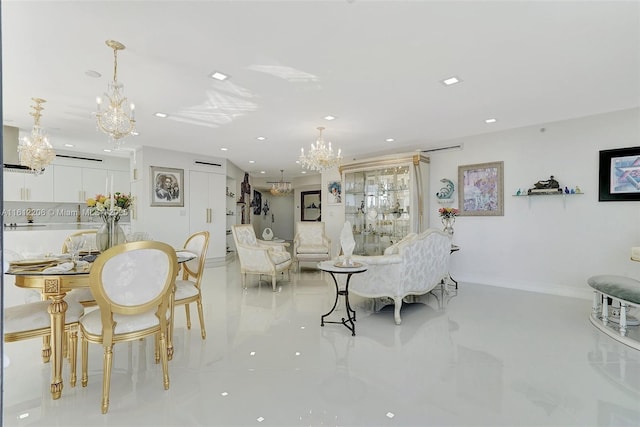 living area featuring a chandelier, recessed lighting, and baseboards