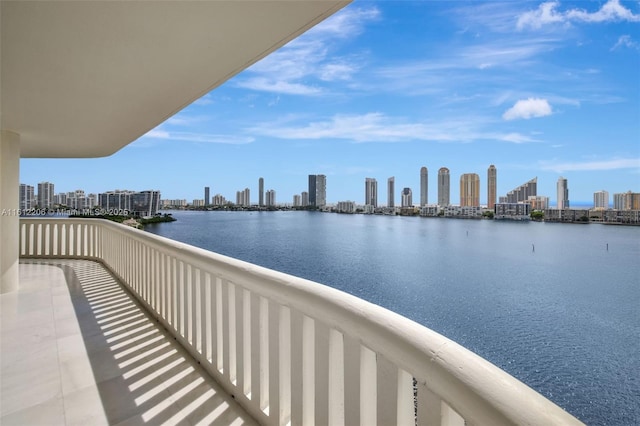 balcony featuring a view of city and a water view