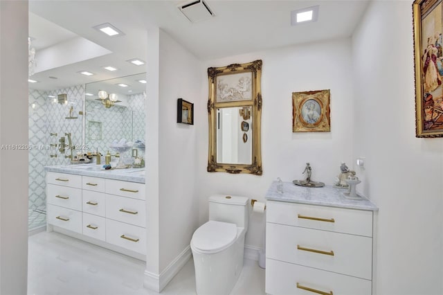 full bathroom with a stall shower, baseboards, visible vents, toilet, and vanity