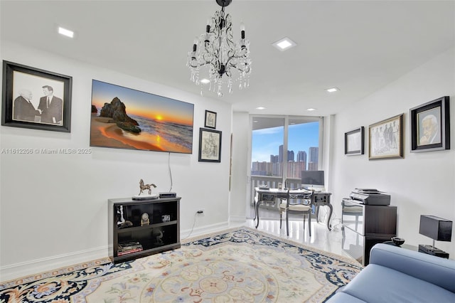 living room featuring baseboards, floor to ceiling windows, and a notable chandelier