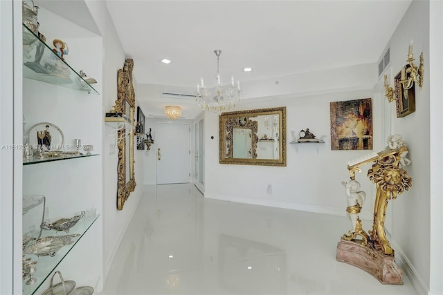 corridor featuring a chandelier and visible vents