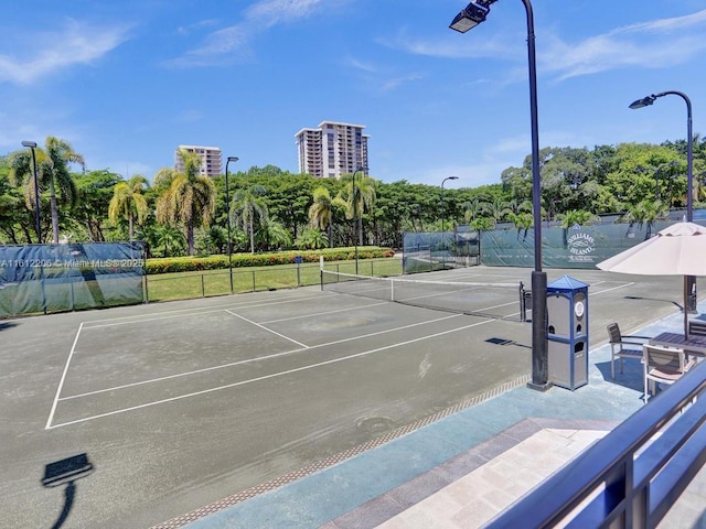 view of sport court with fence