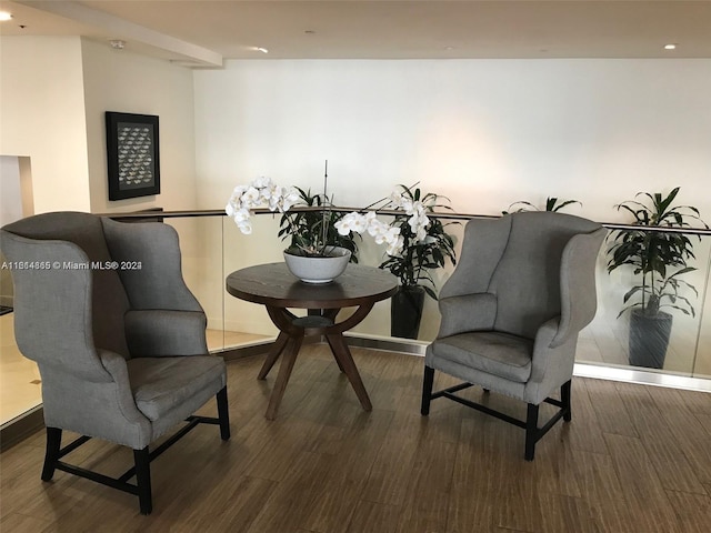 living area with hardwood / wood-style flooring