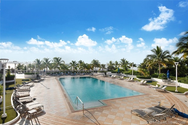 view of swimming pool featuring a patio area