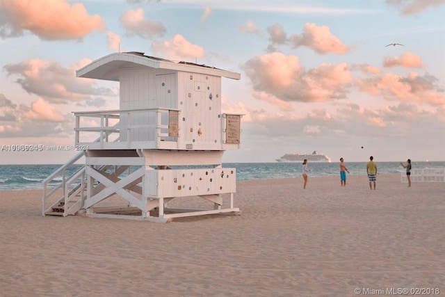 property view of water featuring a beach view