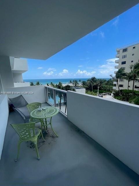 balcony featuring a water view