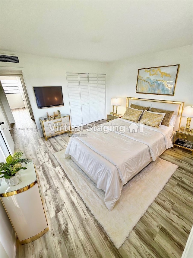 bedroom featuring light wood-type flooring