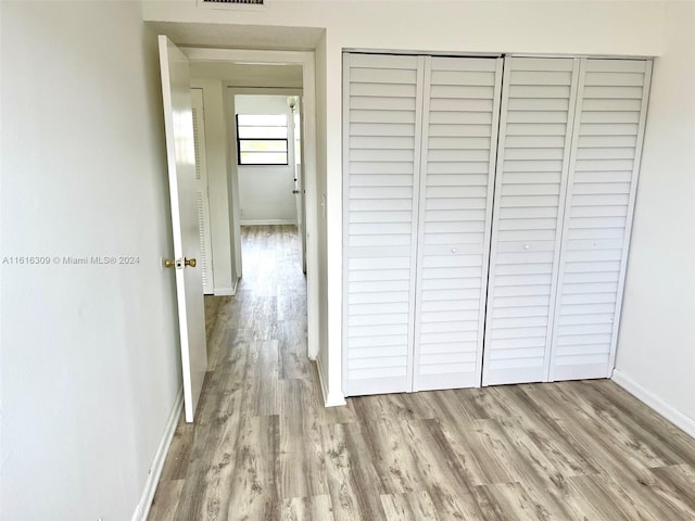 corridor featuring light hardwood / wood-style flooring