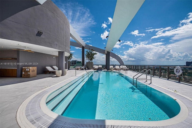 view of swimming pool with a patio area