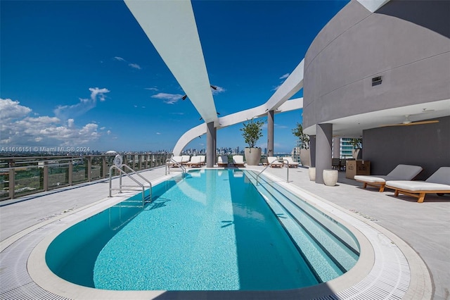 view of swimming pool with a patio area