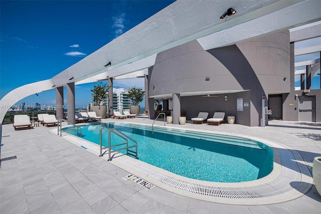 view of pool featuring a patio