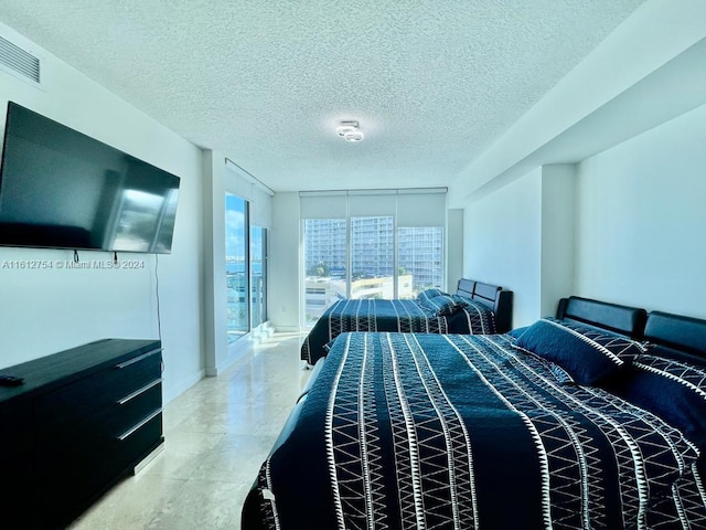 bedroom featuring a textured ceiling