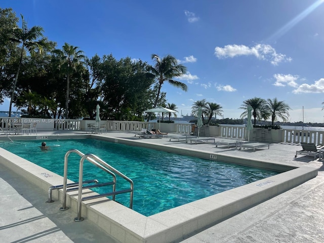 view of swimming pool with a patio area